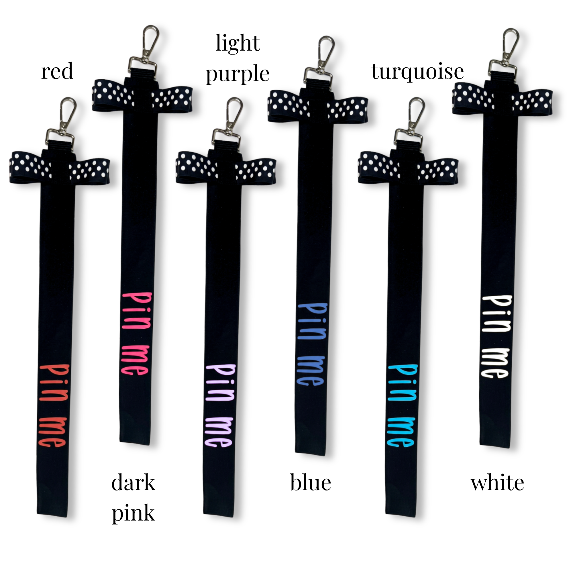 Set of six black cheer pins with polka dot bows in red, dark pink, light purple, blue, turquoise, and white colors, each.