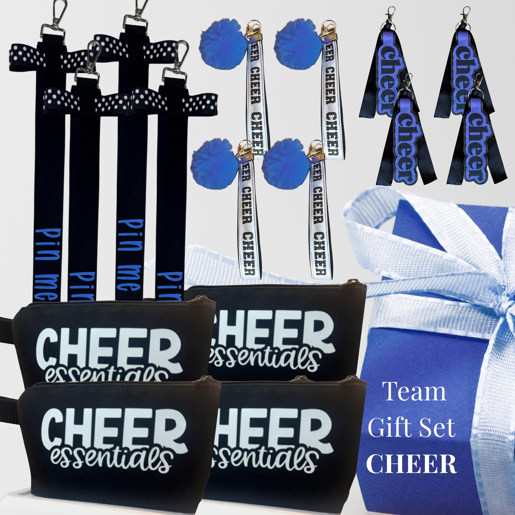 Black and white cheer bag tags and black zippered pouches with Cheer Essentials text, blue bows and ribbons.