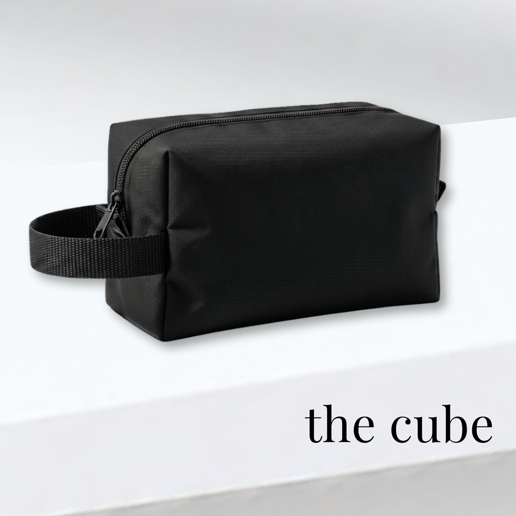 Black rectangular cheer bag with side handle, designed for competition and uniform storage.