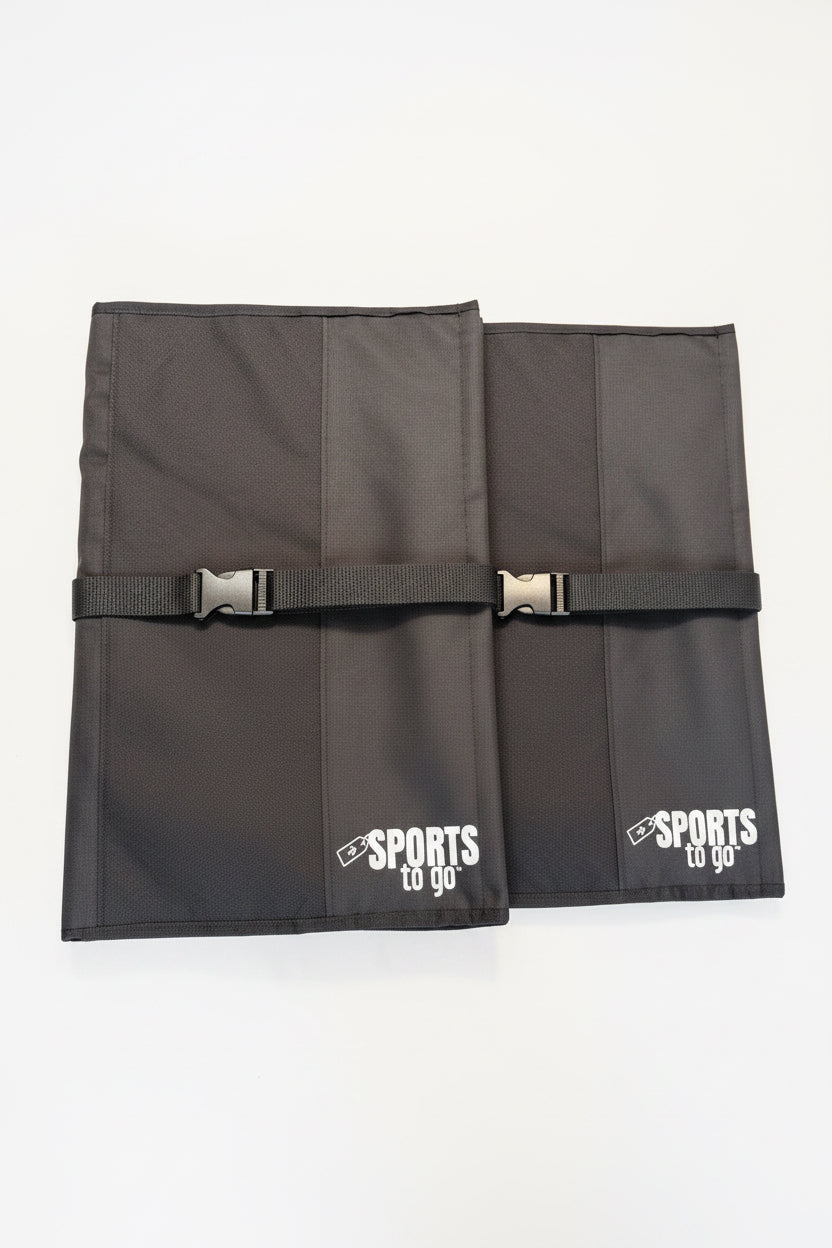 Two black foldable sports bags with buckle straps and white "Sports to Go" logos on the front.