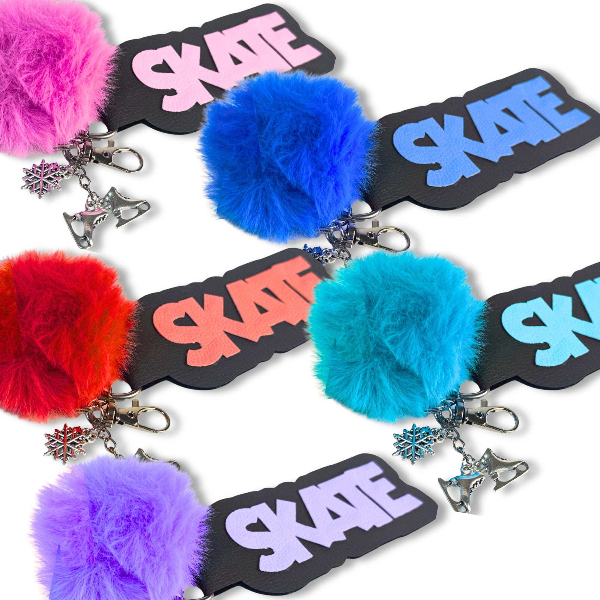 Set of colorful bag tags with "SKATE" text, fluffy pom-poms, and ice skate charms for cheer and competition bags.