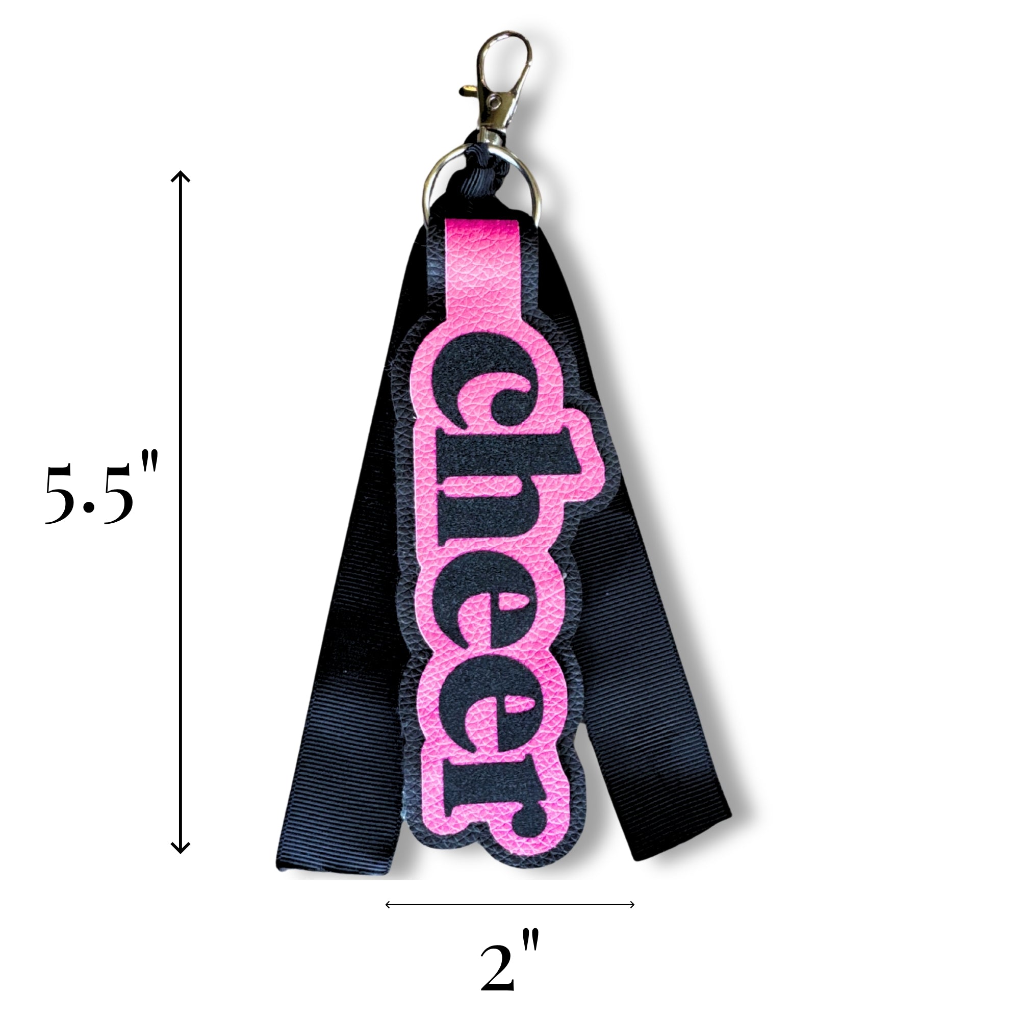 Black and pink fabric bag tag with metal clasp, featuring glittery pink "cheer" text, 5.5 by 2 inches.