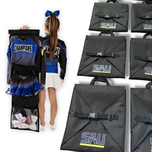 Black garment bags with 'SAU' logo, cheerleader outfit, and a girl holding an open garment bag on a white background