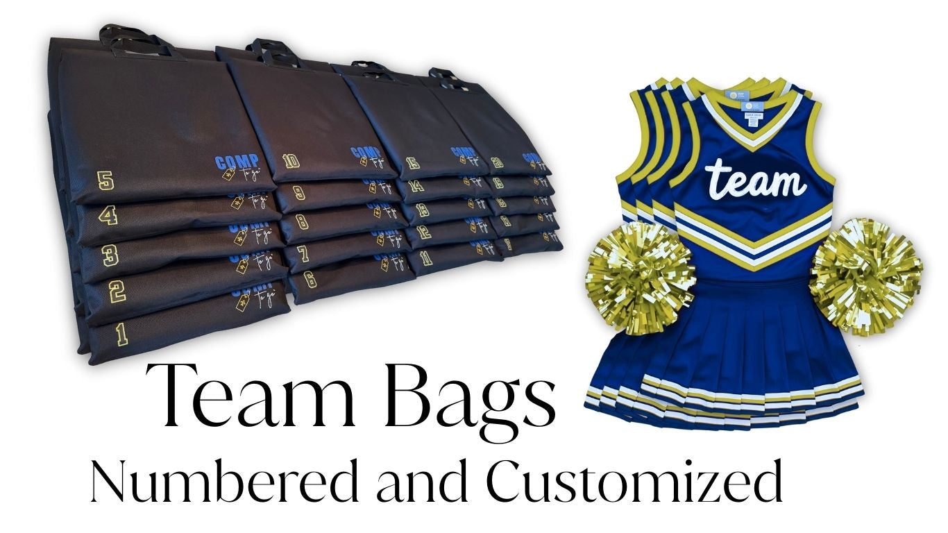 Stack of numbered team bags with a cheerleading outfit and pom-poms on a white background.