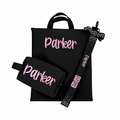 Black cheer competition bag and matching black pouch with pink personalized name "Parker," plus black lanyard with white.