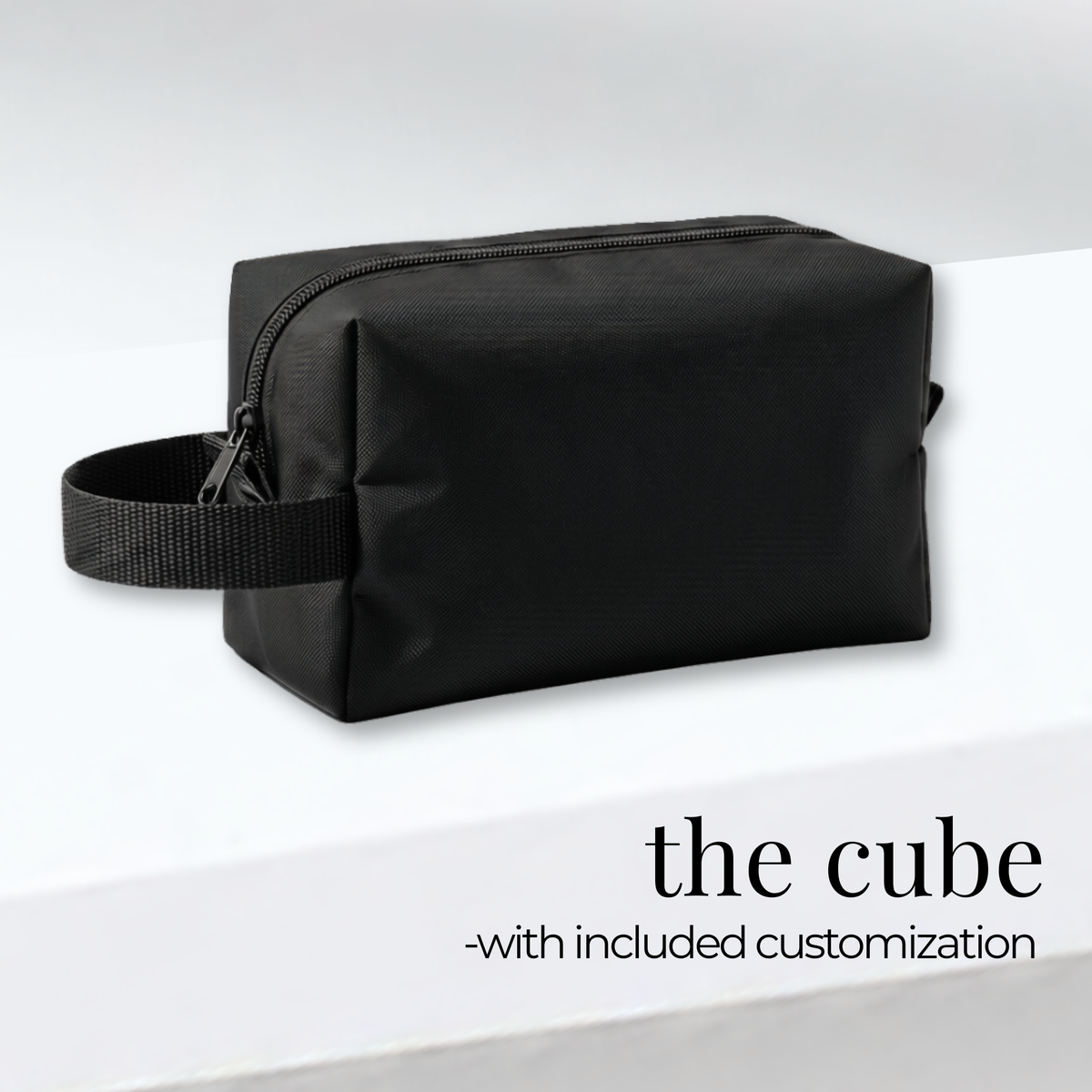 Black rectangular cheer and skate bag with side handle and zippered top, sturdy fabric design.