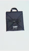 video of a black cheer uniform garment bag opening up to 2 compartments that hold uniform, bows and shoes and golf to close and clip.